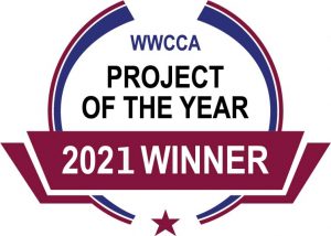 A red, white and blue circle with the words wwcca project of the year 2 0 2 1 winner.